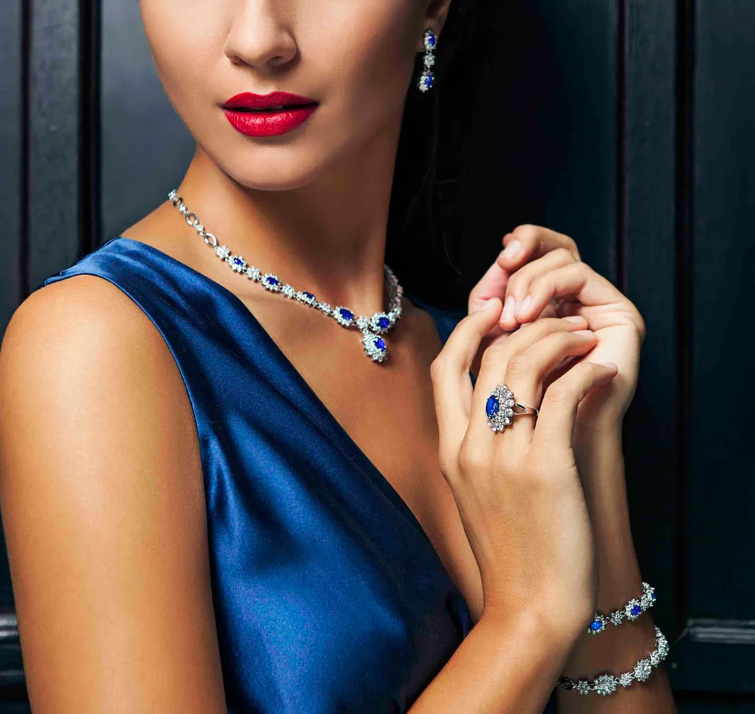 Model wearing a Ceylon sapphire necklace, ring and bracelet suite